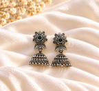 Ornate floral jhumka earrings with green centre accents and beaded dome fringes | SISTERHOODS-SHA256:1dd4cf18a41cb09d23425d8d6461ef104d5c09e6d43472ef726052c6a6603f93