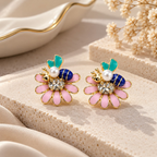 Multicolour floral stud earrings with pink petals, teal leaves, navy accents, white beads and sparkling centres | SISTERHOODS-SHA256:f52b80b5afc43c3aec4ad3718a9316dccc3f67fcd1957b3fffaffe4b3287a750