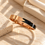 Gold-tone cuff bracelet with glossy black accent and Love detail | SISTERHOODS-SHA256:ecfa29316f95d5db99092d72f13002acff392c126ffa33a45ca7862cbe6d5ffa