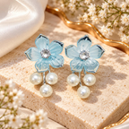 Blue floral dangle earring with sparkling centre and three white pearl drops | SISTERHOODS-SHA256:f7fd779589acbcbe2091682c923726bf431516c1789e2938fc5d5b7d9edfe2c3