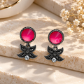 Black floral dangle earrings with vivid pink round accents and clear stones | SISTERHOODS-SHA256:227af33275e30496ee2ce59530acd5450e79e107df12b475ac991d5a8d059282