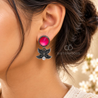 Black floral dangle earrings with vivid pink round accents and clear stones | SISTERHOODS-SHA256:8fef3de9f0b189cc3b14722648052cb2425c84433535971f35b47fcd332364ed