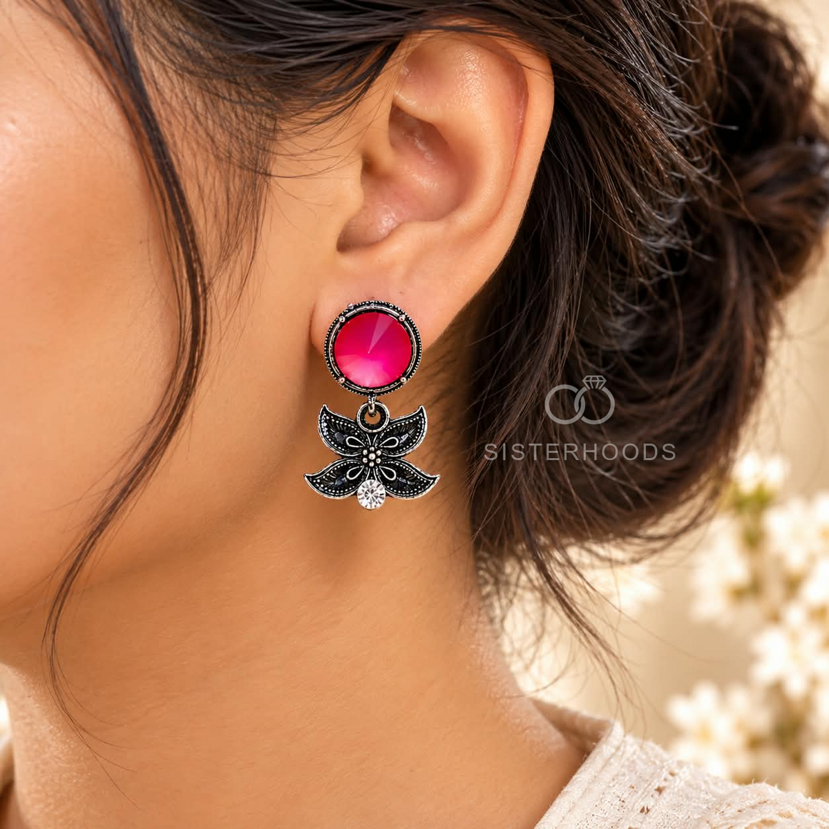 Black floral dangle earrings with vivid pink round accents and clear stones | SISTERHOODS-SHA256:8fef3de9f0b189cc3b14722648052cb2425c84433535971f35b47fcd332364ed