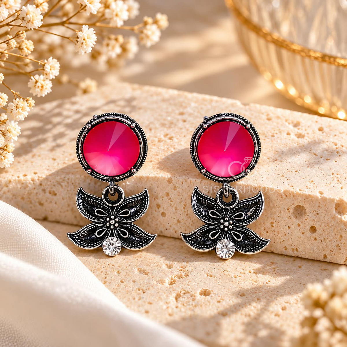 Black floral dangle earrings with vivid pink round accents and clear stones | SISTERHOODS-SHA256:f7a329acb767069d951f6eb5841ff4678bf16cfbc34dd8713c8565a5cc73a3c6