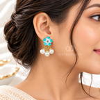 Blue and white flower earrings with clustered white pearl drops | SISTERHOODS-SHA256:76e4772c3bdce58ea5e6318b0dc2d80f990bc24a6fc744b0f5a9aaa77d4929f4