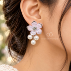 Pink flower earrings with a sparkling centre and three dangling white pearls | SISTERHOODS-SHA256:5fa1eda1b3b90a07b25e9bb34d0d238b8976ba4fe608873722b62ffc240495a0