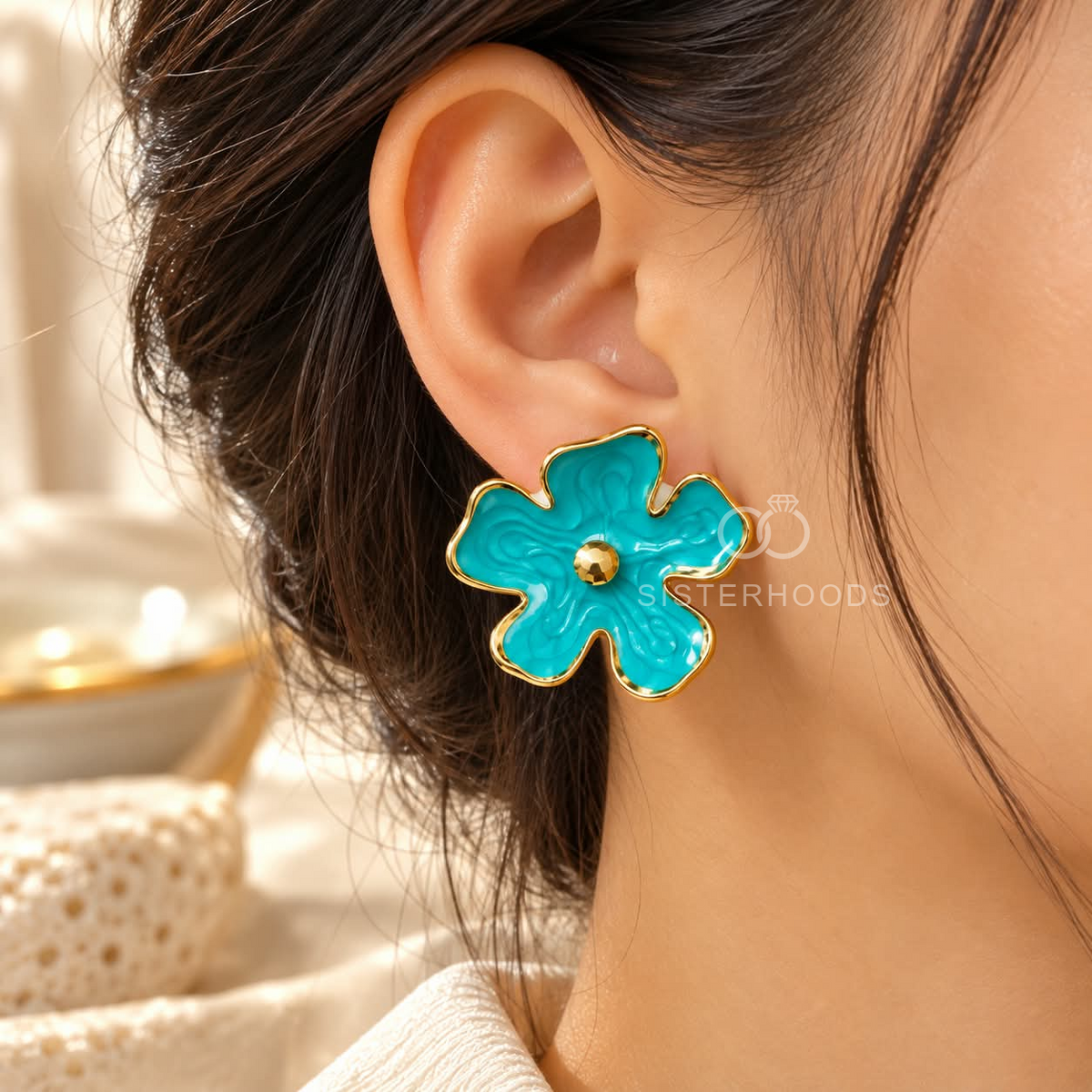 Blue floral stud earrings with gold-tone edges and centre accents | SISTERHOODS-SHA256:9fd4e9d64220038a78273834de9d8bf8a8472a6e69c7f1261c9e48f27d617f7d