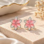 Pink and mint floral stud earrings with silver-tone outlines | SISTERHOODS-SHA256:28587e26cb127dd62763c297804bc77e7251ce85fd0377389393e65e361371b3