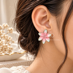 Pink and mint floral stud earrings with silver-tone outlines | SISTERHOODS-SHA256:c7d4372dd61aea2c153b3f6873699635c107ed41ecc4cb88695d43dd5fe8ab5d