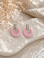 Pink textured hoop earrings with silver-tone top details | SISTERHOODS-SHA256:b5e172fdca50d0ee15b482f1a7c35d7cd5c9d0fb2db9fc3800d6437242096853