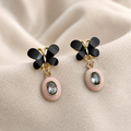 Black butterfly earrings with blush oval faceted drop accents | SISTERHOODS-SHA256:c6a381c7bcb1df09d872098514ac3f64432fed25992a74a27c8dbc2ff3b18310