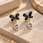 Black butterfly earrings with blush oval faceted drop accents | SISTERHOODS-SHA256:2a2889a3de454818d443ea32c0420f4a86e60d31cf9ebe530d01cc2fd3bd68ba