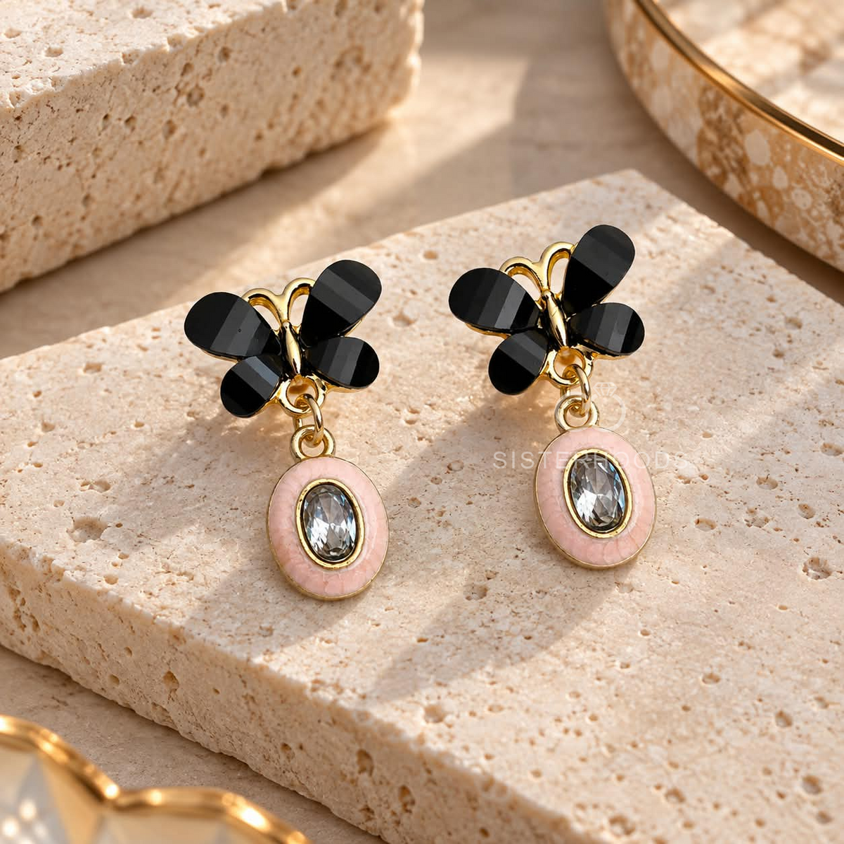 Black butterfly earrings with blush oval faceted drop accents | SISTERHOODS-SHA256:2a2889a3de454818d443ea32c0420f4a86e60d31cf9ebe530d01cc2fd3bd68ba