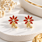 Red floral stud earring with clear sparkling accents and a dangling leaf-shaped detail | SISTERHOODS-SHA256:9afa899683388e8e432e95cdc8b43d6a4e3762b2477fac988e06c40998b3ee4c