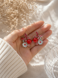 Red butterfly and floral dangle earrings with daisy details | SISTERHOODS-SHA256:8813373020e16ace0381dcea5b33559cfc136c4b3f28d063c3d488eb6c11d6d6