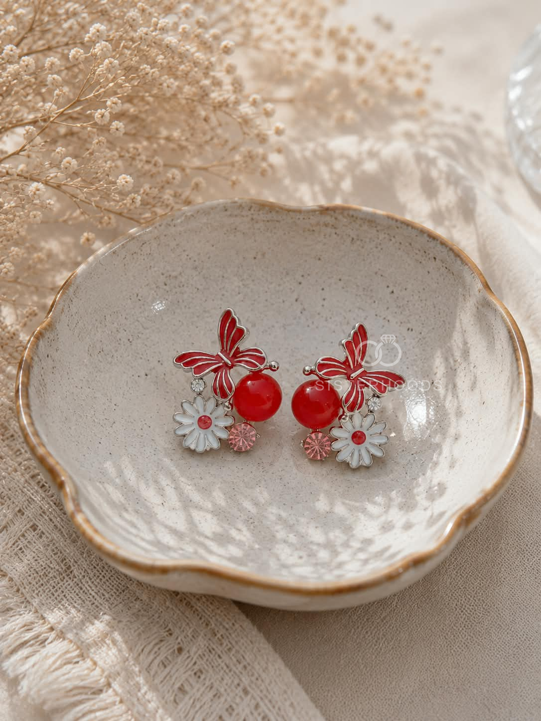 Red butterfly and floral dangle earrings with daisy details | SISTERHOODS-SHA256:bbefc35e12e98daea767e9e8fe0c0bbd251ca93e9a0bd2a8d5161d88664efc97