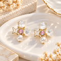 Gold-tone dangle earrings with white pearls, butterfly charms, floral accents, pink details and faceted square tops | SISTERHOODS-SHA256:af254ad48c6cf984fee515b3b62398d87f52d65f590a00098543e69dbbcda30f