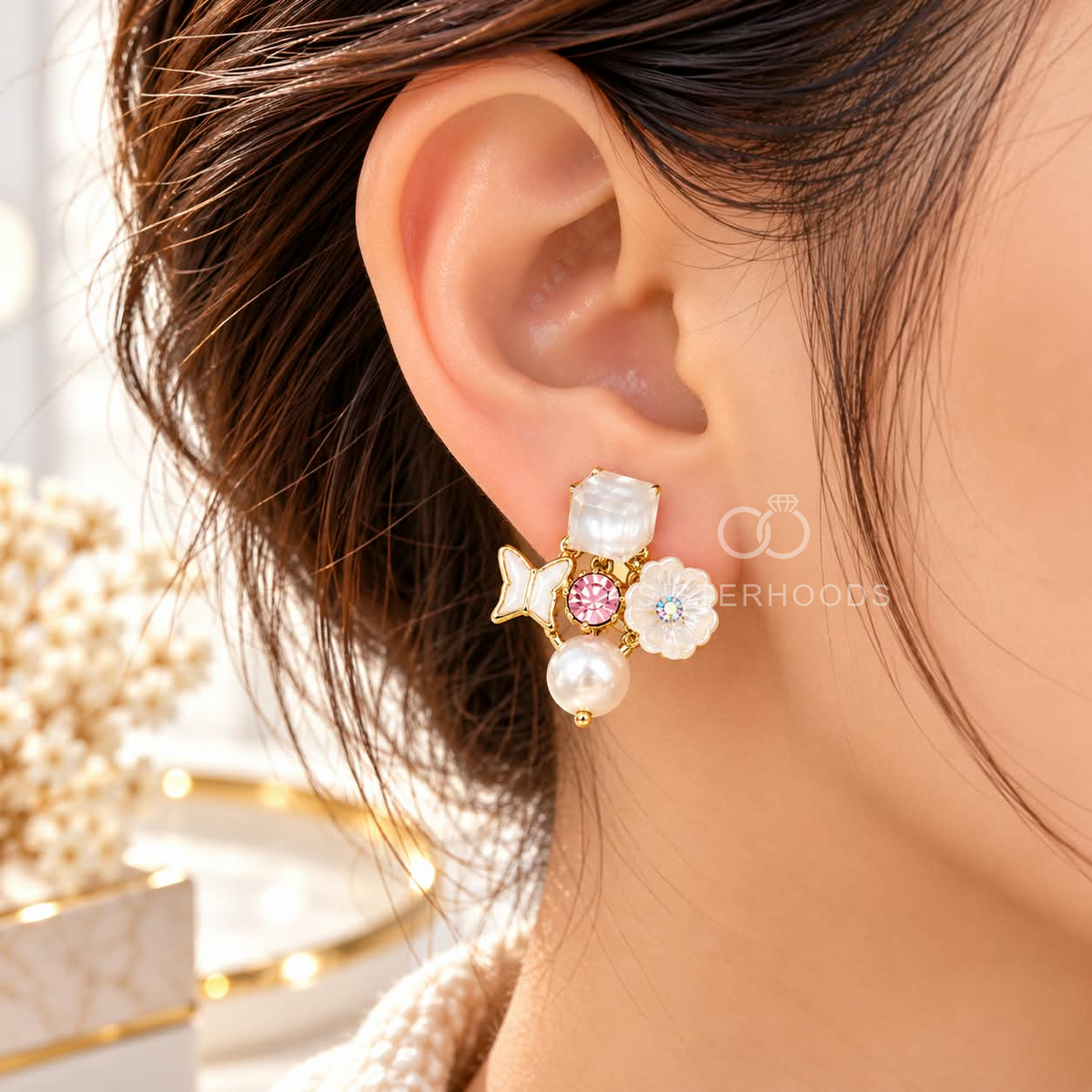 Gold-tone dangle earrings with white pearls, butterfly charms, floral accents, pink details and faceted square tops | SISTERHOODS-SHA256:d1adbdf0b32d5381694f62c718e78a4021ec3806130472dbc70a63adc105abc5
