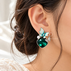 Teal butterfly dangle earrings with faceted green oval accents and white details | SISTERHOODS-SHA256:36893f02052cb11cd8acc5d2acb48fbbb02b5834e460efd7dc6fae6ca652de35
