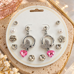 Silver-tone butterfly dangle earrings with faceted pink heart pendants | SISTERHOODS-SHA256:7c268de1d8bb476023a4304e51cc365445ca7bddcbb3082955e6e5d974eb4e15