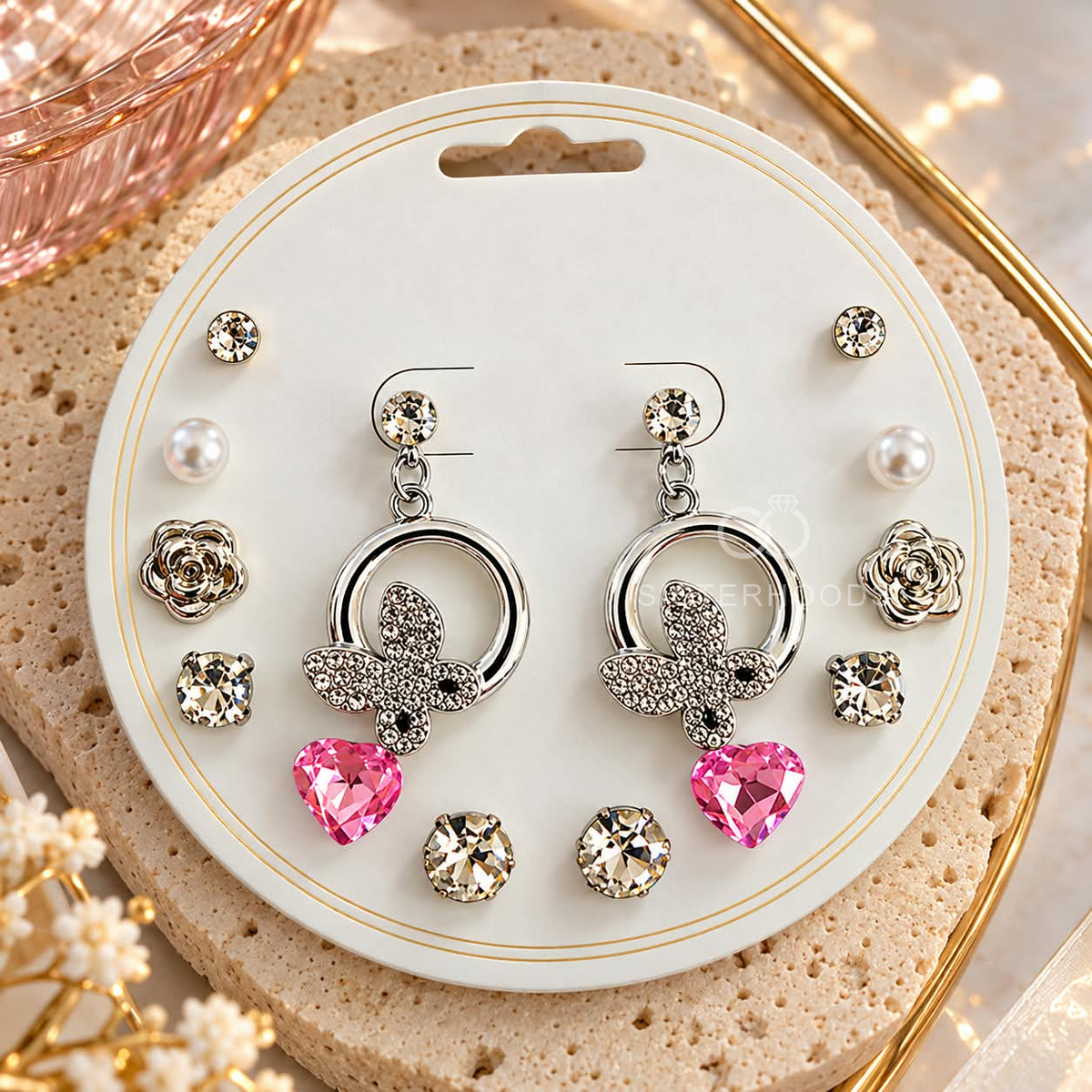 Silver-tone butterfly dangle earrings with faceted pink heart pendants | SISTERHOODS-SHA256:7c268de1d8bb476023a4304e51cc365445ca7bddcbb3082955e6e5d974eb4e15