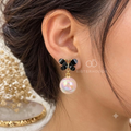 Black butterfly earrings with pink iridescent pearl drop accents | SISTERHOODS-SHA256:9f172d7da08e73dffa5408c825fd8dd6cce44e0a344e0d1f7f15ea882ac83fba