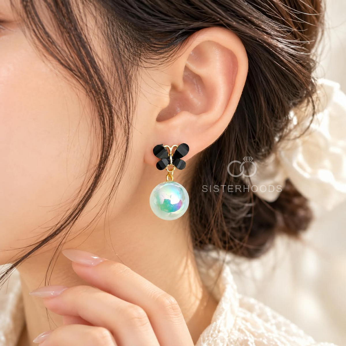 Black butterfly earrings with iridescent aqua round drops | SISTERHOODS-SHA256:cd18886f44f879730fd227b6202d4a62f1fe66daf95e3d6033ae3ebb97c7bf73
