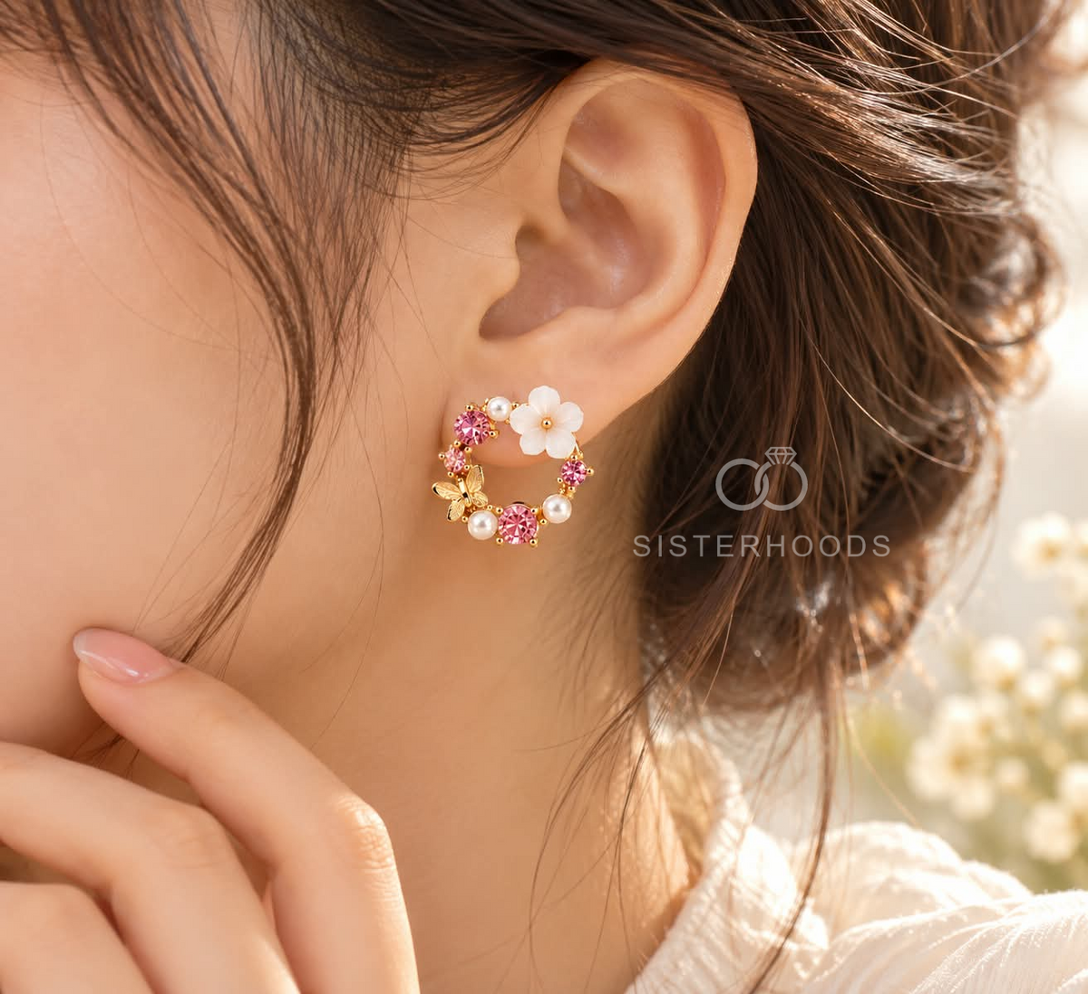 Round floral stud earrings with pink accents, white flower detail, delicate beads and butterfly motifs. | SISTERHOODS-SHA256:5dcd206cd1a587af256cb4dbf3dde5c3565a5d9df055f491e62ca486ac4cfa9e