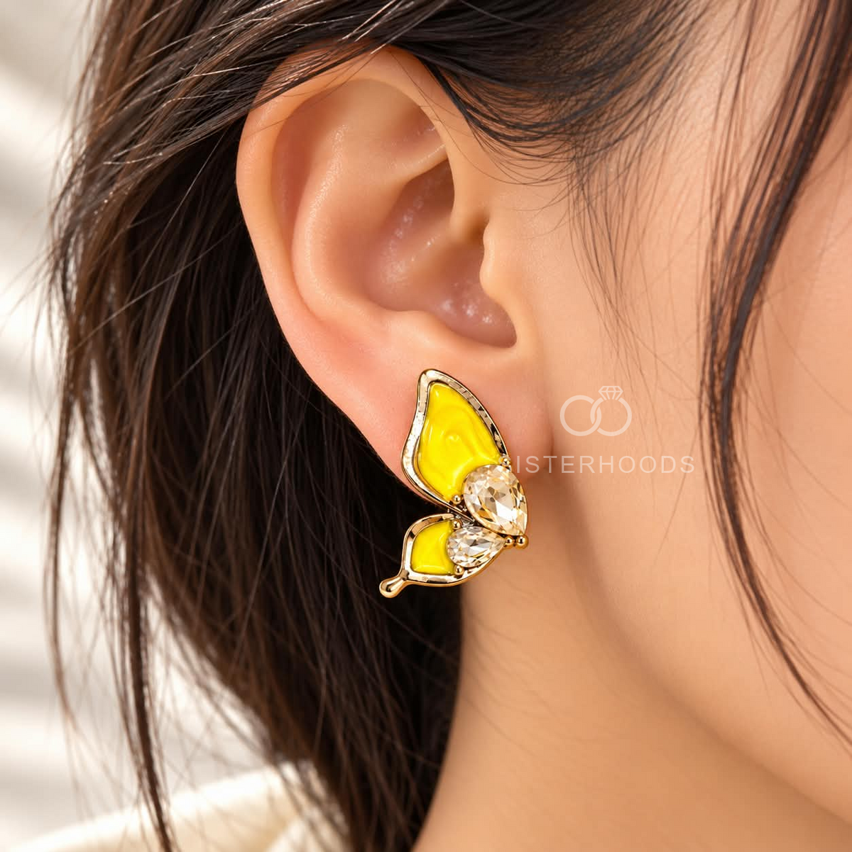 Yellow butterfly stud earrings with faceted clear accents and golden detailing | SISTERHOODS-SHA256:28ddd1ee9258f9c11f93439bc725d38591f0a8a7bee4a56c9c6fe6d7b01d7ace