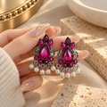 Oxidized silver-tone dangle earrings with magenta stones and white bead drops | SISTERHOODS-SHA256:675b5a49177d0e986d3c4b90a318da408961f2943f8a0222a6db205bd5e40b8d
