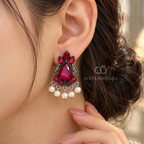 Oxidized silver-tone dangle earrings with magenta stones and white bead drops | SISTERHOODS-SHA256:3121b9eaae3f1e8796e8710238c51b1bdd57f5f06a5fe0f123b7b57c5b5224dd