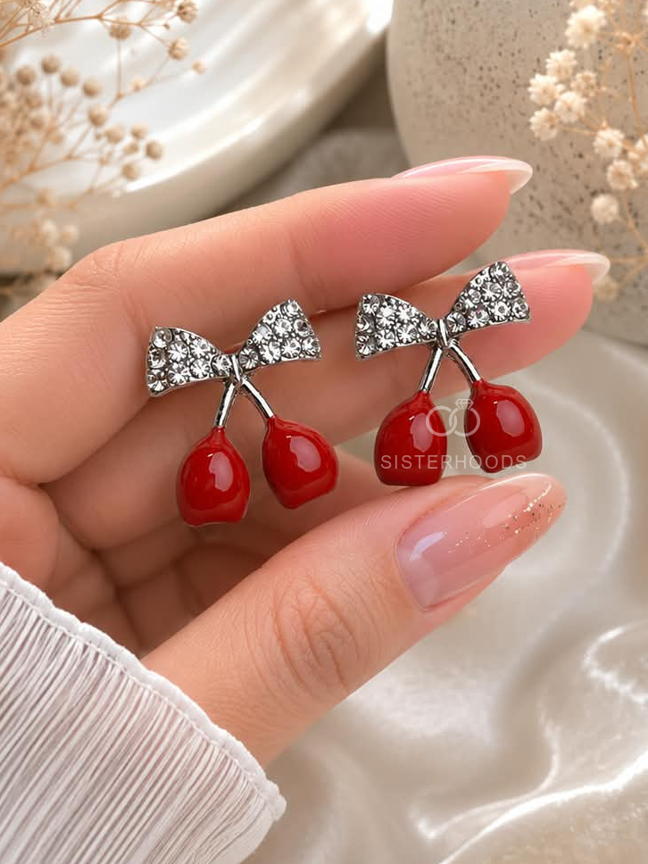 Silver bow drop earrings with red cherry-shaped dangling charms | SISTERHOODS-SHA256:c273bb88c7add084f9de1b219e3d290cd63189dfd2f0e42742ad01bcea0690e1