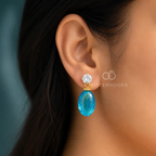 Blue faceted oval drop earring with clear round accent and gold-coloured detailing | SISTERHOODS-SHA256:e87d71427be02448dd26efb2a780de01a299a2f6a6c902f5c7e2c746fa913e09