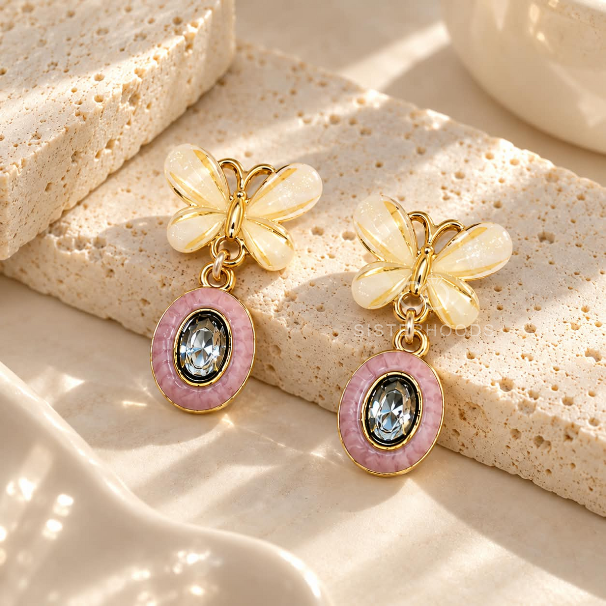 Korean drop earrings with ivory flower tops, pink oval accents and faceted blue centres | SISTERHOODS-SHA256:7b8c3ea6a05ec12db9e6c6bb0cd569dd8ecbc1b76622899ce07b8c0beb37f2d4