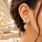 Korean drop earrings with ivory flower tops, pink oval accents and faceted blue centres | SISTERHOODS-SHA256:8aedc503c1a9ab61fb52f2a28057b03b0dd3bf56d45f65eab307b88e27f7b53b