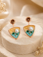 Multicolour triangular drop earrings with round stud tops and white, green and teal accents | SISTERHOODS-SHA256:aa43cbfeb4d1430579bb10c2408e31e5f571479eebe20807a82866ef80ee527c