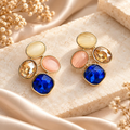Multicolour cluster stud earrings with blue, pink, cream and amber-toned faceted details | SISTERHOODS-SHA256:dea2c5950626db7907b9a4db4b59199150f1dddec3ba5415dc3861c1aac21973