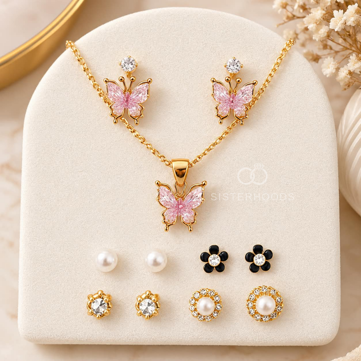 Gold-tone butterfly necklace with pink butterfly pendant, matching earrings and assorted pearl, floral and crystal stud earrings | SISTERHOODS-SHA256:f8894b716cb86de535aff4e611bf46a8f14869445e3fbd3c654a43ddcb0918d6