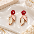 Multicolor leaf-inspired drop earrings with red round studs and blush ivory dangling accents | SISTERHOODS-SHA256:2aaf1c00929c1ed10152863be659d2732a06ad1605fd1210898d41ee71f8e7bb