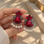 Deep red oxidized floral dangle earring with cascading white bead accents | SISTERHOODS-SHA256:51aeb3dc0f5fcec9bf0c02a20bf5cd195af6e4773fb96bc2ababe17b380a71af