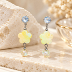 Silver-tone dangle earring with crystal stud, yellow flower and colourful shimmer ball | SISTERHOODS-SHA256:ba1fa8d97fcb74c047b7be08c1c22b9172593f7f38377e543d92f4673e57e193