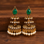 Green teardrop jhumka earrings with crystal accents and white bead fringe | SISTERHOODS-SHA256:280f9098036f3b2f1e071a023d1e9fb0c1ef5e0f1bcbc8ceff13a84fe83f6bf4