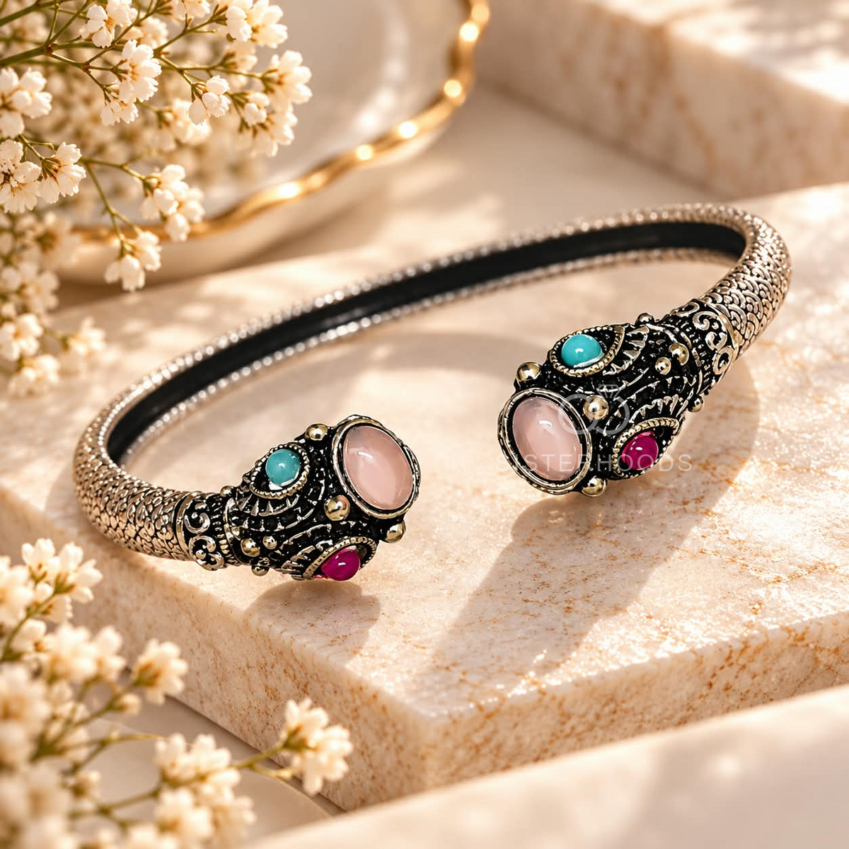 Ornate open cuff bracelet with dark detailing and pink and turquoise oval accents | SISTERHOODS-SHA256:7666625003b3a00222bd32efd219ebc4f318dd9814d72c05412260e72ecbd1f8