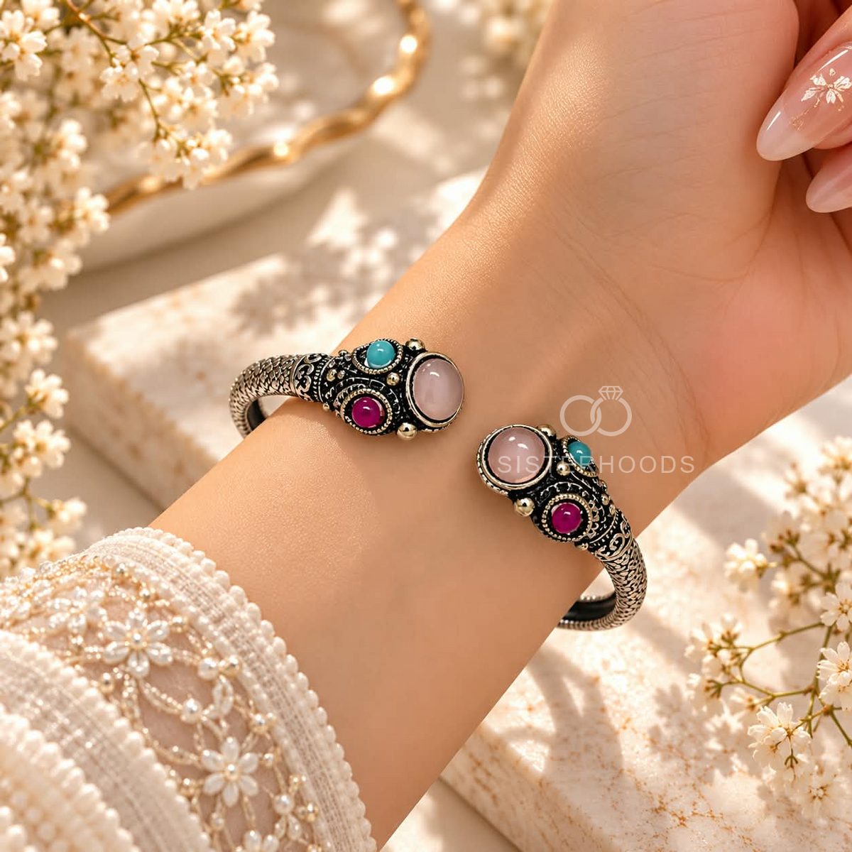 Ornate open cuff bracelet with dark detailing and pink and turquoise oval accents | SISTERHOODS-SHA256:91ab8335604b13204f70708792ef12f39569975fc91e874f51907fae7eec330e