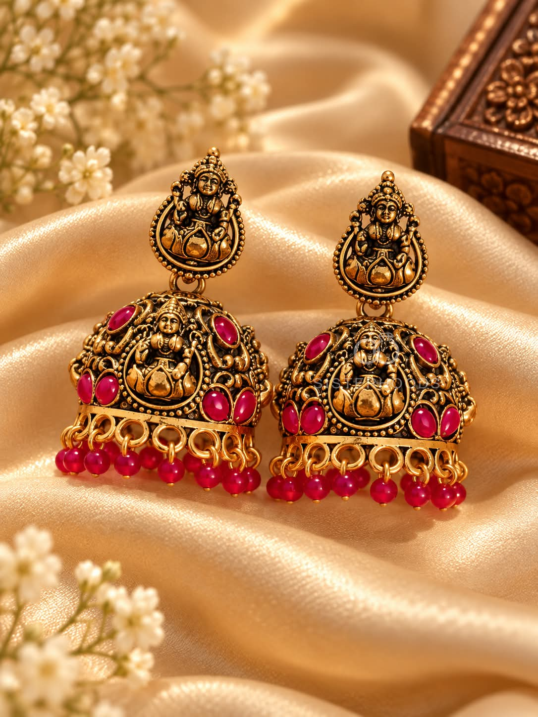 Ornate Lakshmi-inspired oxidized jhumka earrings with red bead accents and dangling beaded fringes | SISTERHOODS-SHA256:1a585b4a70b95dbe5c729d9f970af5645cf7e8c1d0894f910407bd4516ea3c71