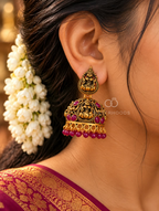 Ornate Lakshmi-inspired oxidized jhumka earrings with red bead accents and dangling beaded fringes | SISTERHOODS-SHA256:adaa1083579a49afaa6e0dd6fed2c2e6ea55abce027852634584b481e250c677