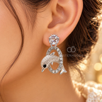 Silver dolphin motif stud earrings with sparkling circular accents | SISTERHOODS-SHA256:7a070f9274ec251efaa3487314c62ceaea55c8b70726dd4d3626719e1b7cd775