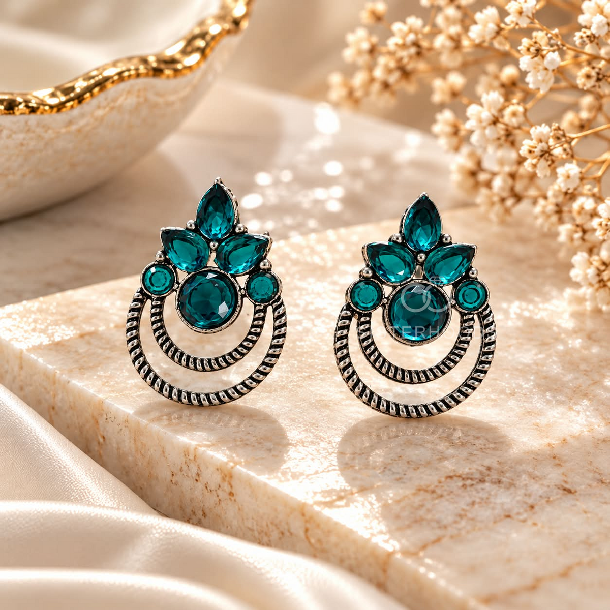 Teal floral dangle earrings with circular oxidized-style detailing | SISTERHOODS-SHA256:232998dce69b1de970793438643091bb1352f49290bfce21c006e2507c397b21