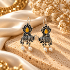 Oxidized elephant and lotus dangle earrings with white pearl drops | SISTERHOODS-SHA256:d62234696a7f4a54ba213d419ceeecf3b20a7581202327dad61ee81f4044a260