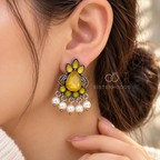 Saffron teardrop oxidized dangle earrings with leafy motifs and pearl fringe | SISTERHOODS-SHA256:a60b9e143447aab81659cb4eab6ae9aebb3990dfcdebe7fa72a3415d3070b466